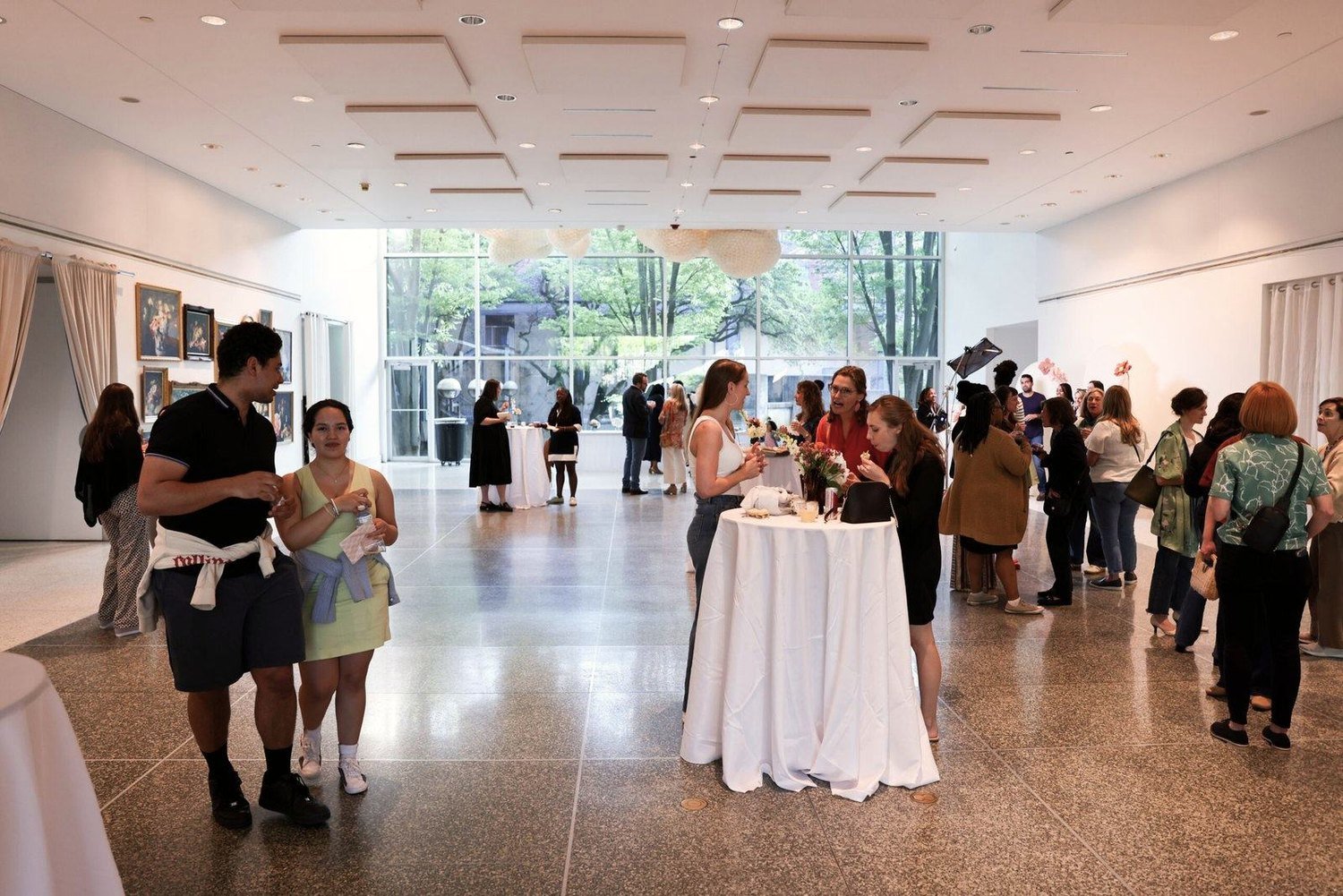 A crowded reception with tables and conversation